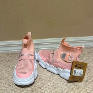Brand new school age girl size one champion sneakers. Box not included.